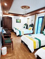 Deluxe Quadruple Room, Balcony, City View | In-room safe, desk, blackout drapes, soundproofing