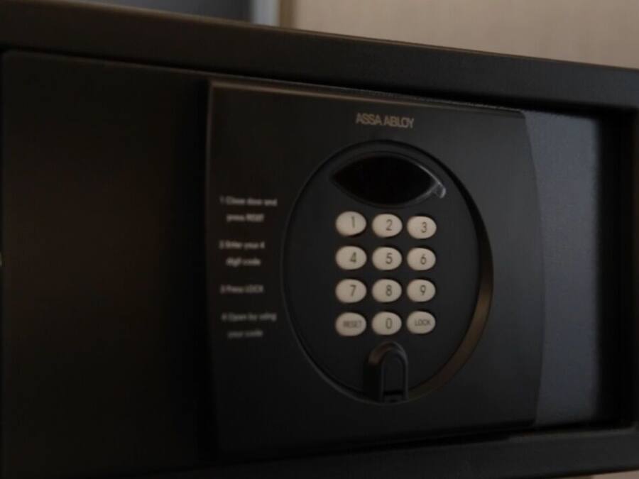 A black microwave with a keypad and a digital display.