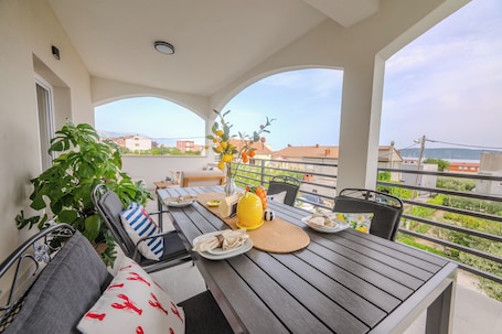 Outdoor dining. A1 luxury apartment near beach with big terrace and the sea view