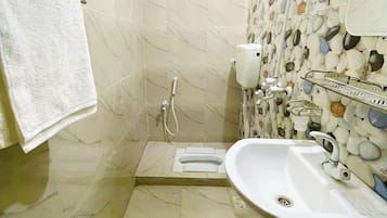 Shower, slippers, soap, toilet paper