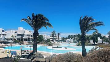 2 outdoor pools, pool umbrellas, pool loungers