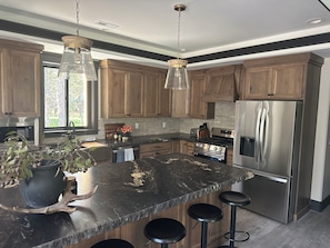 Private kitchen - New 4 bedroom 2 Loft cabin w/ Hot tub on beautiful Bill’s Island.  Can sleep 16 (Island Park)