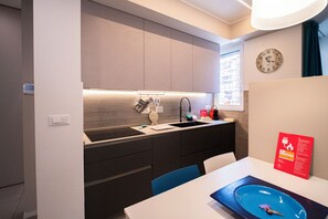 Apartment, Balcony | Private kitchen | Fridge, microwave, oven, stovetop - Casa Rattazzi by Wonderful Italy (Albisola Superiore)