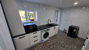 Fridge, microwave, stovetop, coffee/tea maker