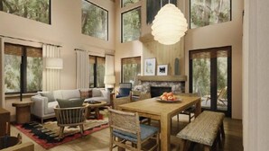 A spacious living area with a fireplace, large windows, and a high ceiling. - Premier Villa Escape: Nature, Dining, Fireside (Stevenson)