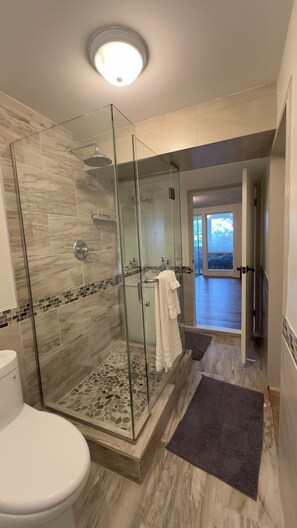 Shower, hair dryer, towels, toilet paper