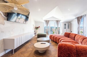 Apartment, 3 Bedrooms, Sea View | Living area | 65-inch Smart TV with digital channels, heated floors