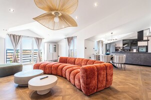 Apartment, 3 Bedrooms, Sea View | Living area | 65-inch Smart TV with digital channels, heated floors