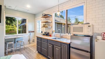 Fridge, microwave, toaster, cookware/dishes/utensils