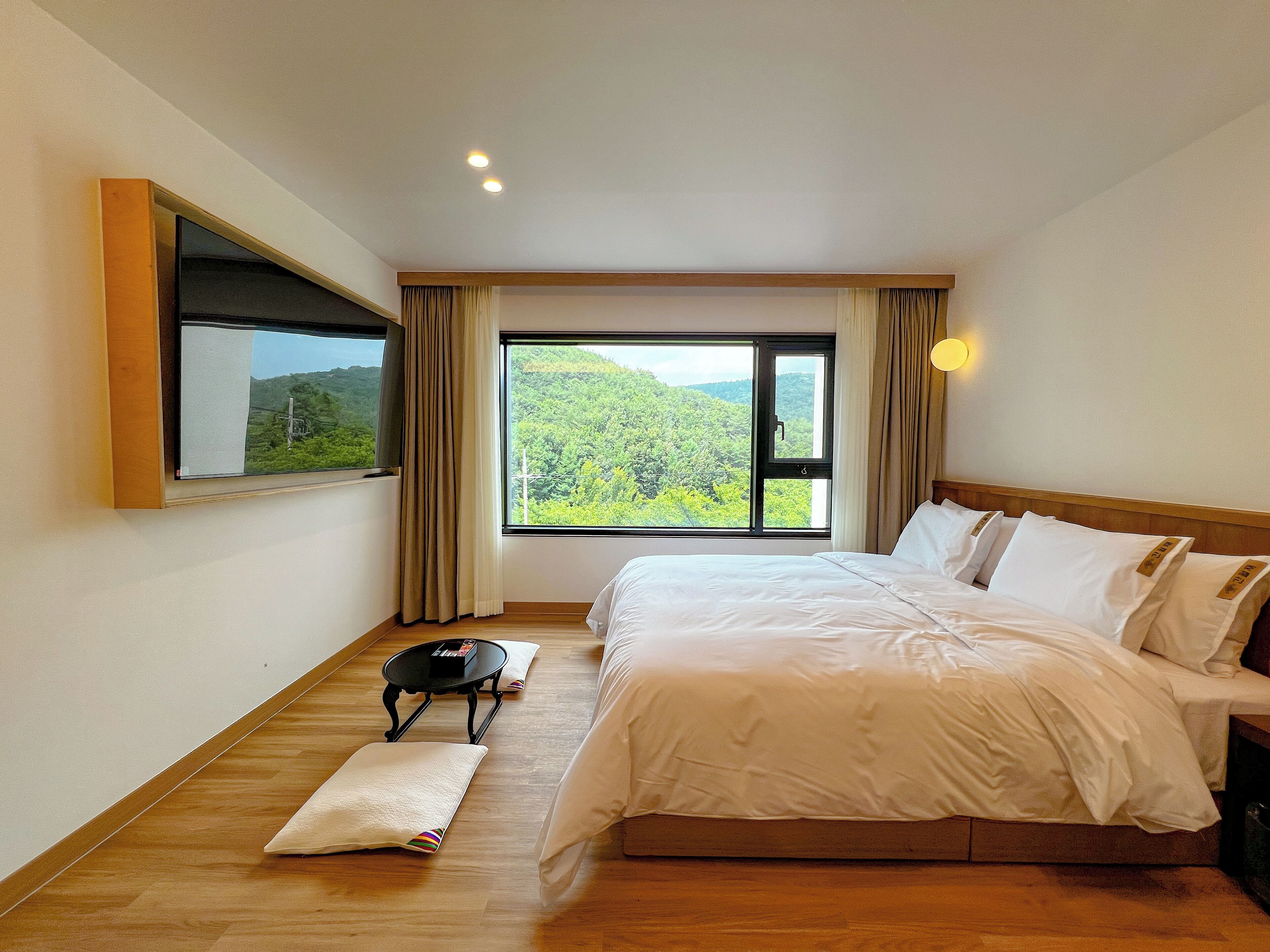 Down duvets, desk, laptop workspace, blackout curtains