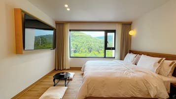 Down duvets, desk, laptop workspace, blackout curtains