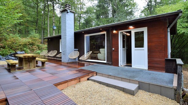 A modern cabin with a deck, outdoor seating, and a chimney. - Cozy Chalet With Barbecue (Viroinval)