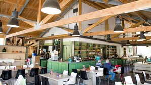 A spacious café with high wooden beams and pendant lighting. - Nice Chalet With Dishwasher, on the Veluwe (Otterlo)