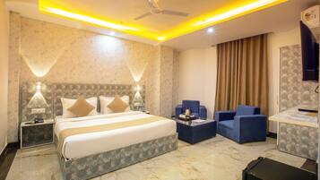 Deluxe Triple Room, City View | In-room safe, desk, laptop workspace, soundproofing