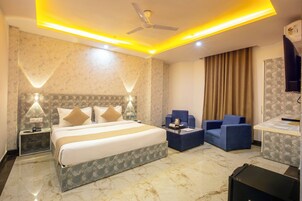 Deluxe Triple Room, City View | In-room safe, desk, laptop workspace, soundproofing