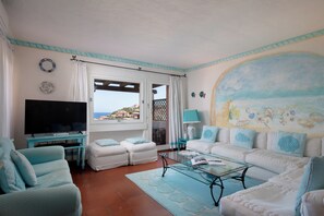 Comfort Apartment, Sea View | Living area | 30-inch TV with satellite channels - Cerbiatta al Molo Apartments by Wonderful Italy (Arzachena)