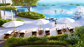 Ein Poolbereich mit Liegestühlen, Sonnenschirmen und Blick auf das Meer.