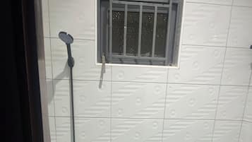 Shower, towels, soap, toilet paper