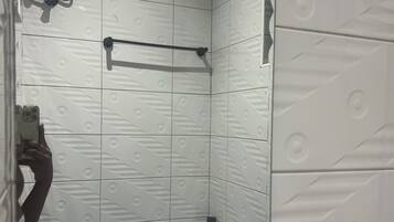 Shower, towels, soap, toilet paper