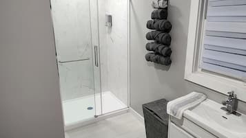 Shower, hair dryer, towels, soap