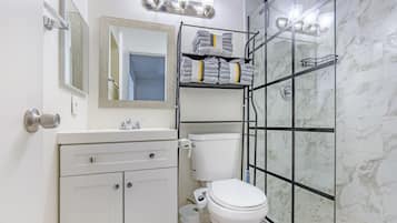 Shower, hair dryer, towels, soap