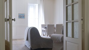 A room with a bed, a chair, a table, and a window with curtains. - Flat fishing port Les Sables - 4 pers (Les Sables-d´Olonne)