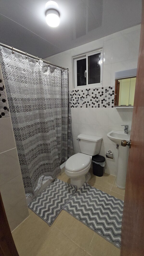Shower, hair dryer, towels, soap