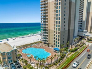 A hotel with a pool, beach access, and a view of the ocean. - The Ocean Retreat 404-Gulf Views-Sleeps 6 (Panama City Beach)