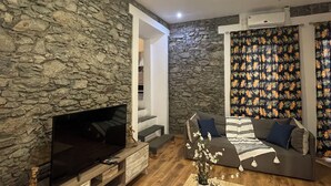 Suite, 1 queensize bed | Woonruimte