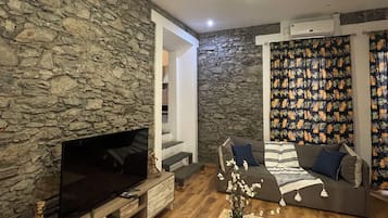 Suite, 1 Queen-Bett | Wohnbereich