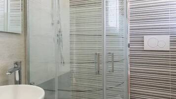 Shower, eco-friendly toiletries, hair dryer, towels