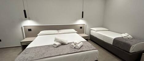 Standard Triple Room, Non Smoking, Private Bathroom | Memory foam beds, minibar, desk, laptop workspace