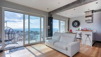 Apartment, Balcony, Sea View | Living area | 35-inch TV with digital channels