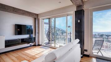 Apartment, Balcony, Sea View | Living area | 35-inch TV with digital channels