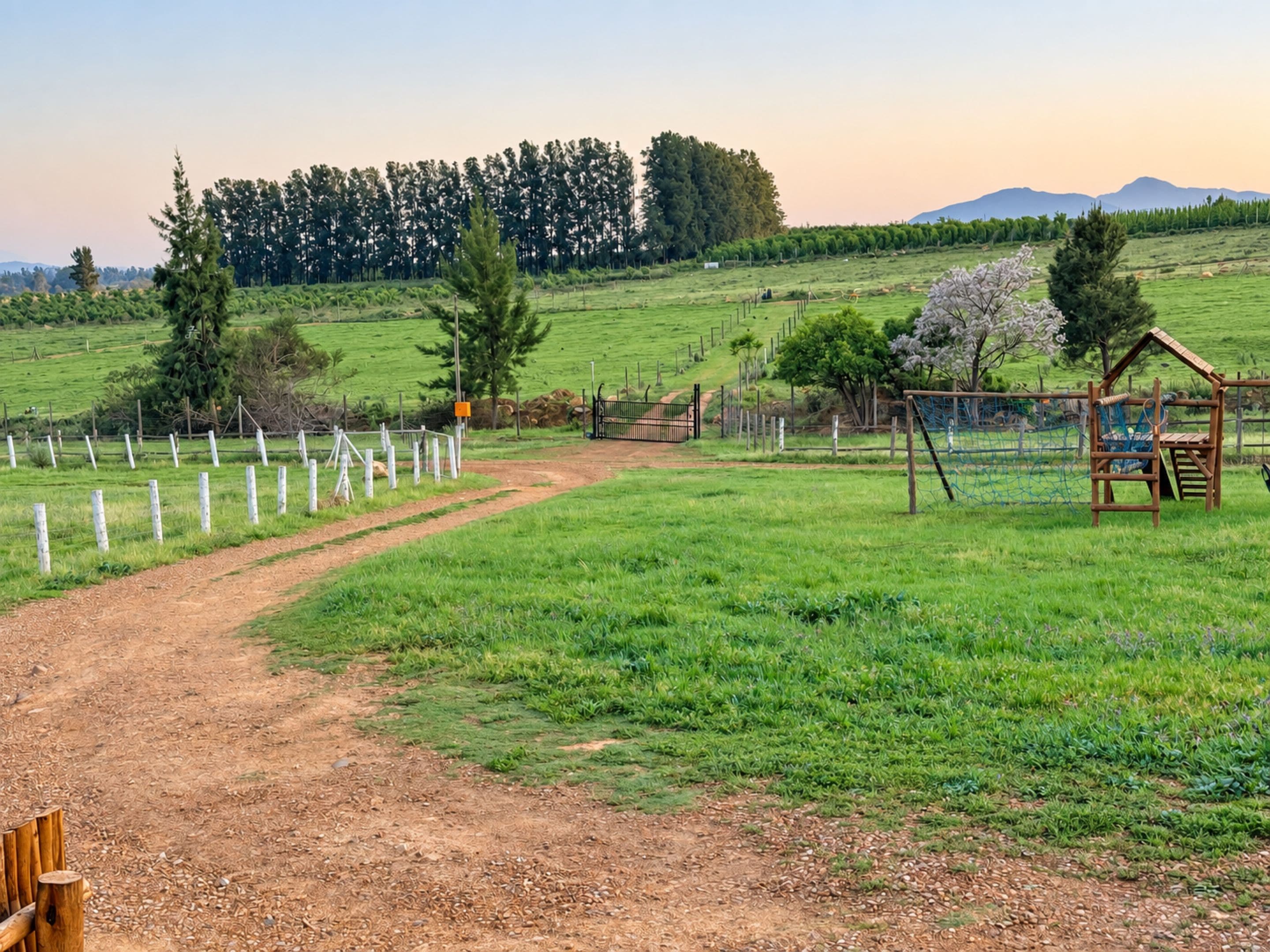 A rural landscape with a dirt path, wooden fence, and a wooden playhouse.