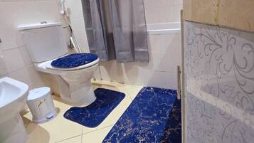 Bidet, towels, toilet paper