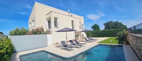 Seasonal outdoor pool, pool umbrellas, pool loungers