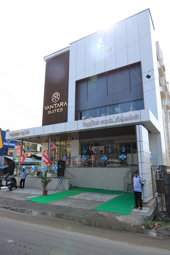 A modern building with a sign for Vantara Suites. - VANTARA SUITES (Vellore)