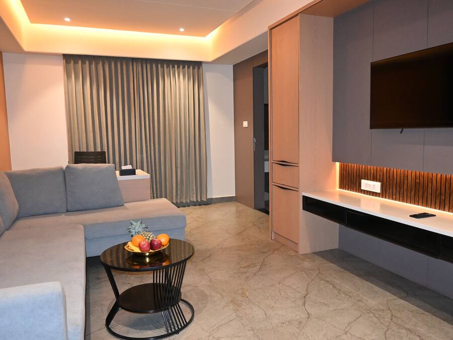 Luxury Suite, City View | Living area | 43-inch LED TV with cable channels