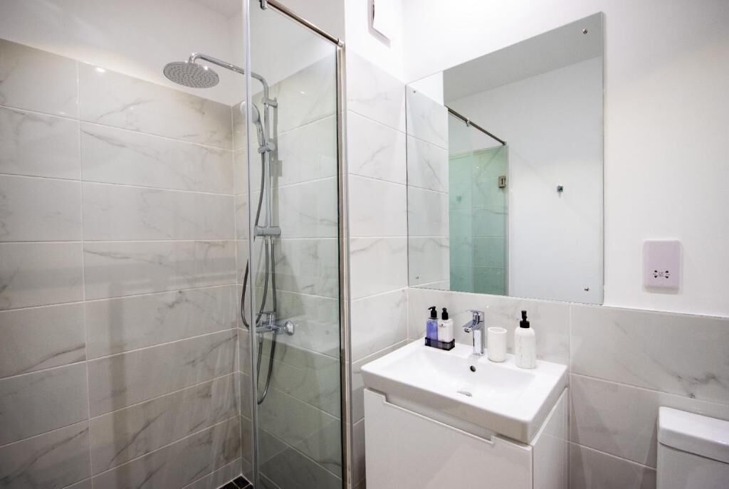 Shower, towels, soap, toilet paper