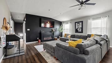 Smart TV, fireplace, foosball, books