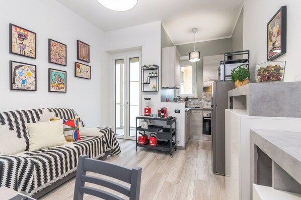 Apartment, Balcony | Living area | 35-inch TV with digital channels