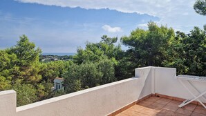 A rooftop terrace with a view of the sea and surrounding greenery. - 1 bedroom awesome home in Vieste (Vieste)