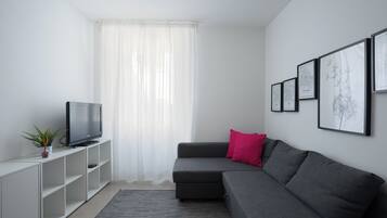 Apartment | Living area | 35-inch flat-screen TV with digital channels