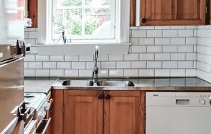 Fridge, stovetop, dishwasher, coffee/tea maker