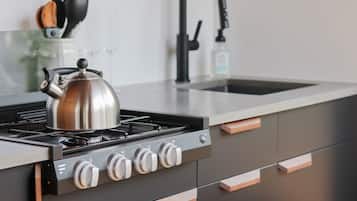 Fridge, stovetop, coffee/tea maker, cookware/dishes/utensils