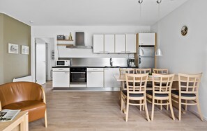 Fridge, stovetop, dishwasher, coffee/tea maker