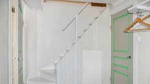 A white staircase leading to a door with green trim. - Cozy home in Kristinehamn with WiFi (Kristinehamn)