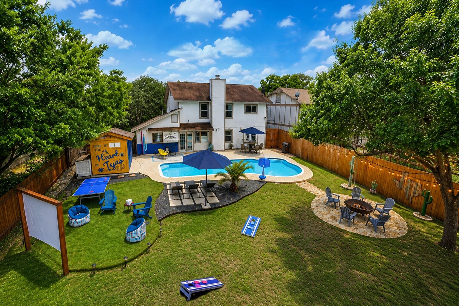 A backyard with a swimming pool, lounge chairs, and a play area.