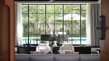 Luxury Villa | Living area | 50-inch TV with satellite channels